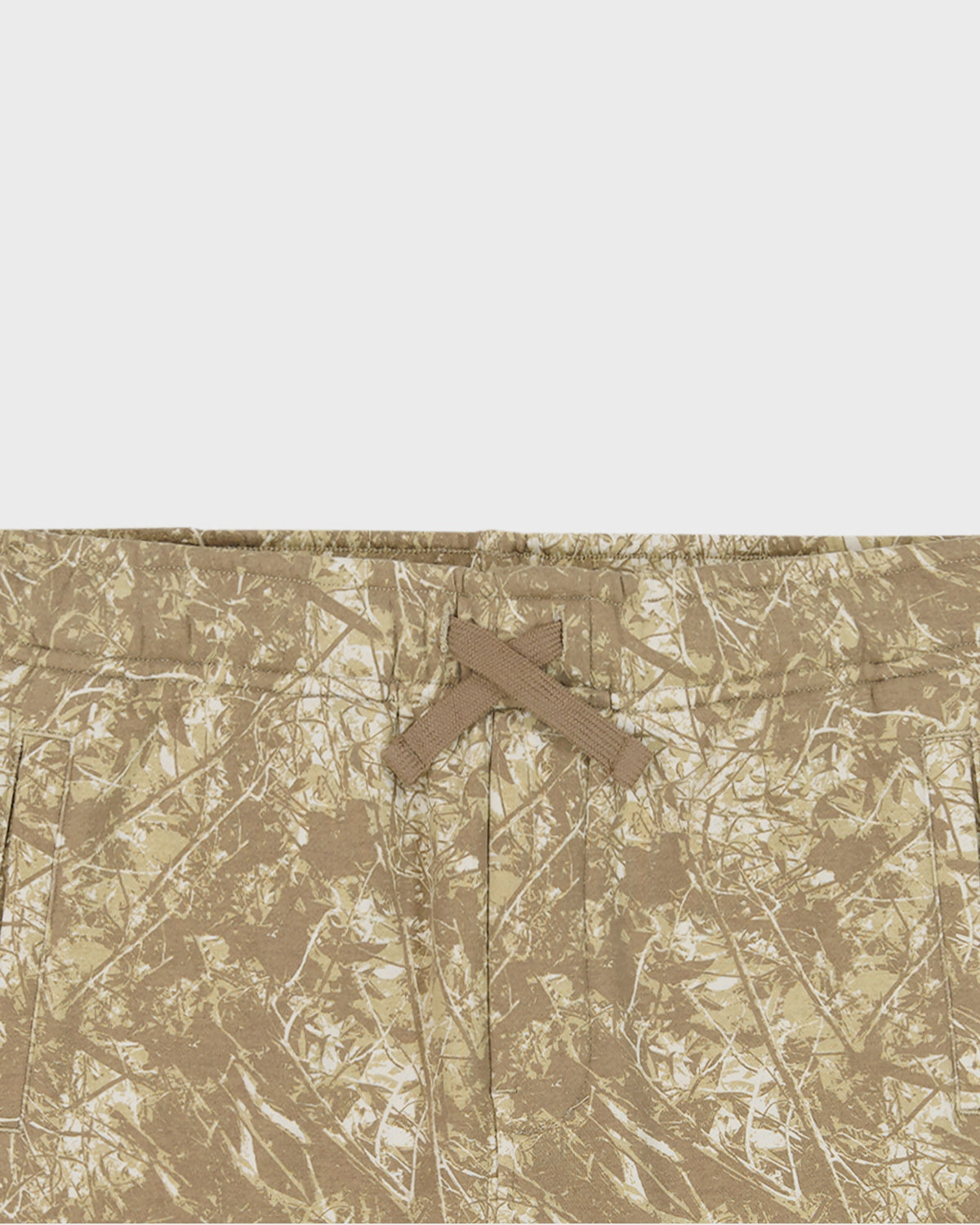 Camouflage pattern with a cross symbol on a textured beige background