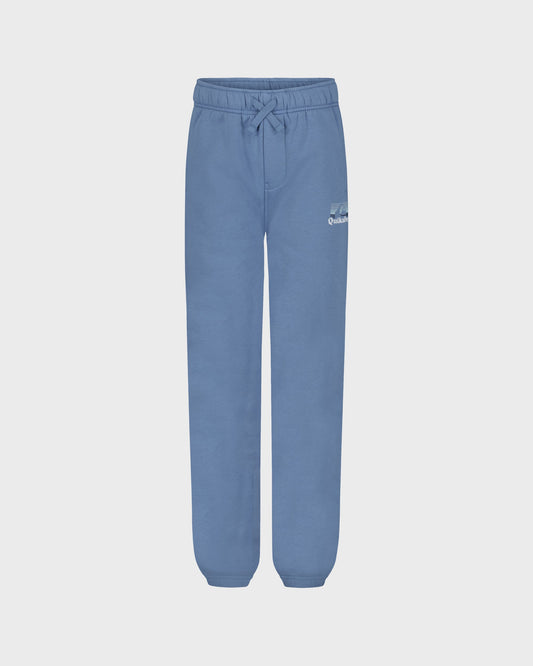 Blue sweatpants on a light gray background