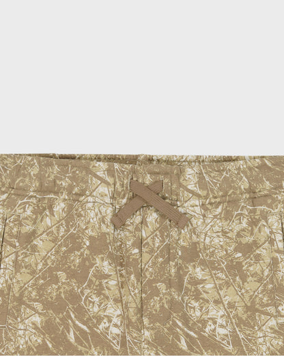 Camouflage pattern with a cross symbol on a textured beige background