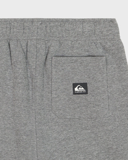 Gray shorts with a brand logo on the pocket against a white background