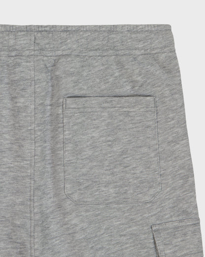 Close-up of black pants with a button on a white background